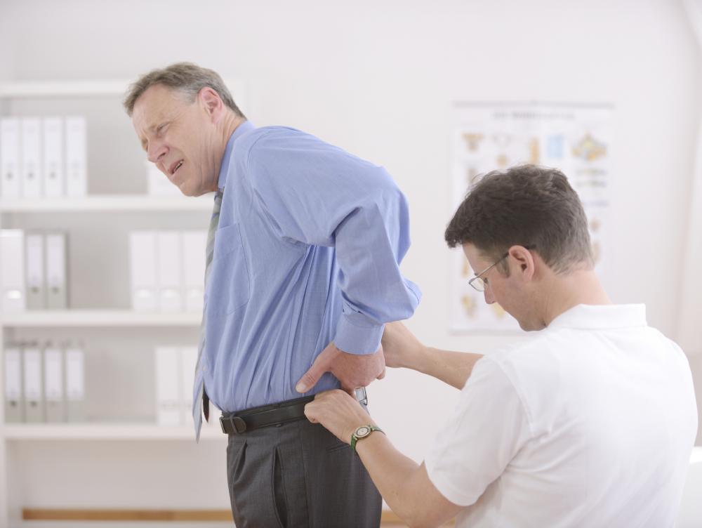 Man with back pain seeing his chiropractor after an auto accident.